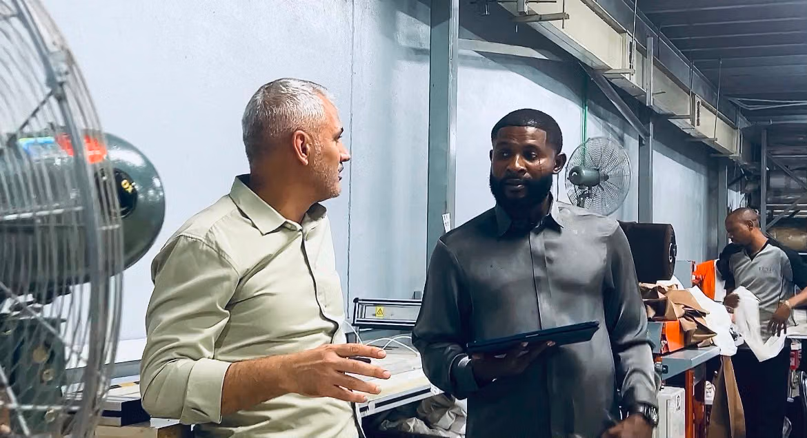 Matthew Aigbosa reviewing a project with a colleague