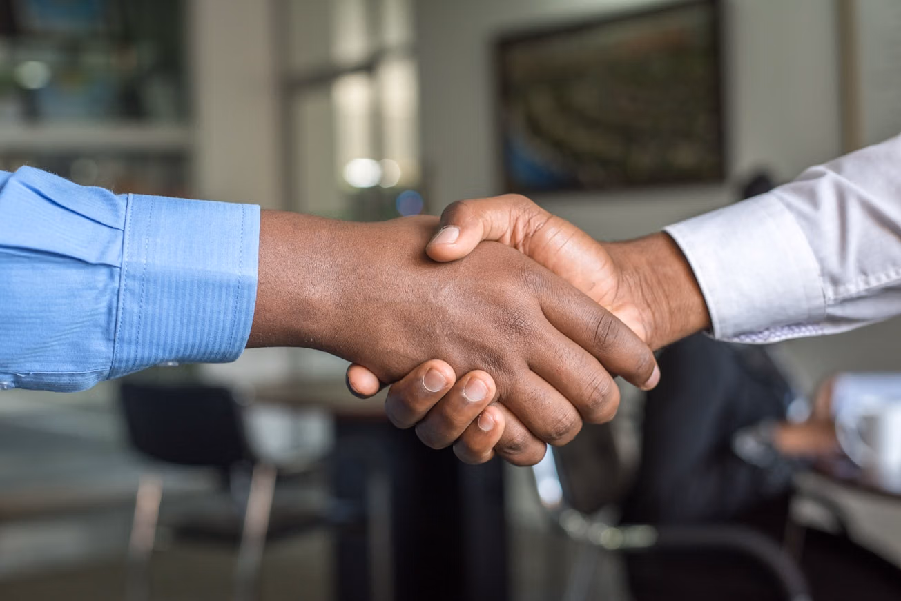 Shaking hands at project completion
